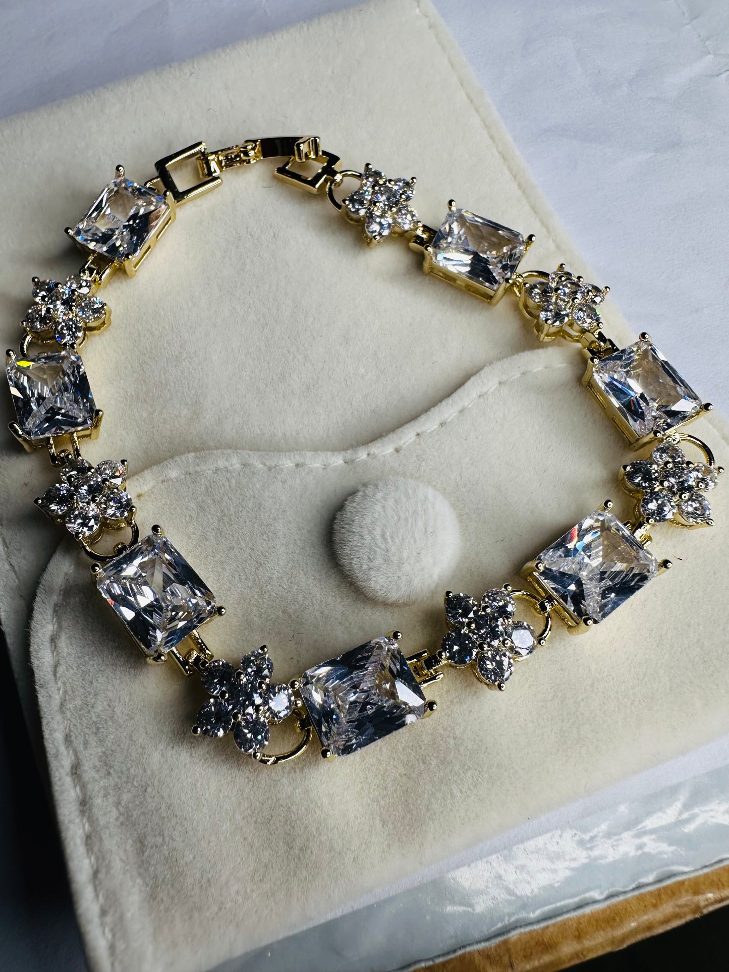 Céleste Royale Gold Tennis Bracelet – Emerald Cut CZ & Flower Cluster Links